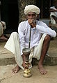 Old_man_smoking_hookah,_near_Jaipur,_Rajasthan,_India[1]